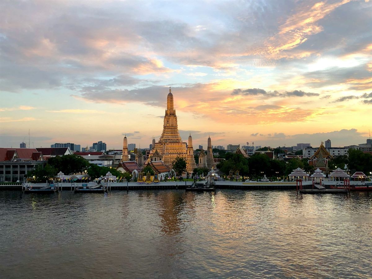 Temple beside the river in Bangkok at dusk